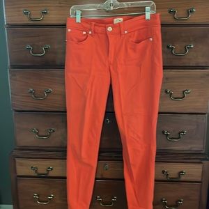 J. Crew toothpick coral jeans.